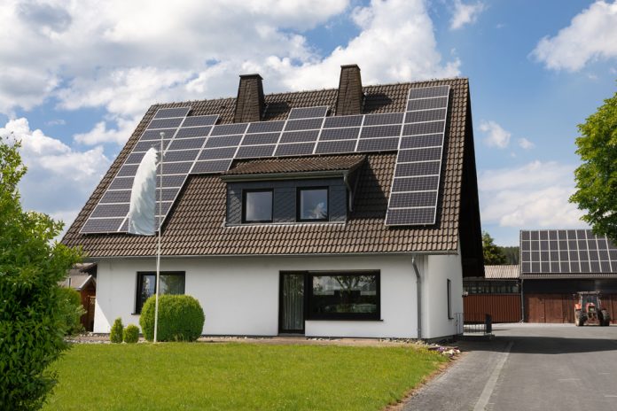 A,House,With,Solar,Panels,On,The,Roof.,A,Farm